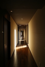 a long hallway with light coming through the windows