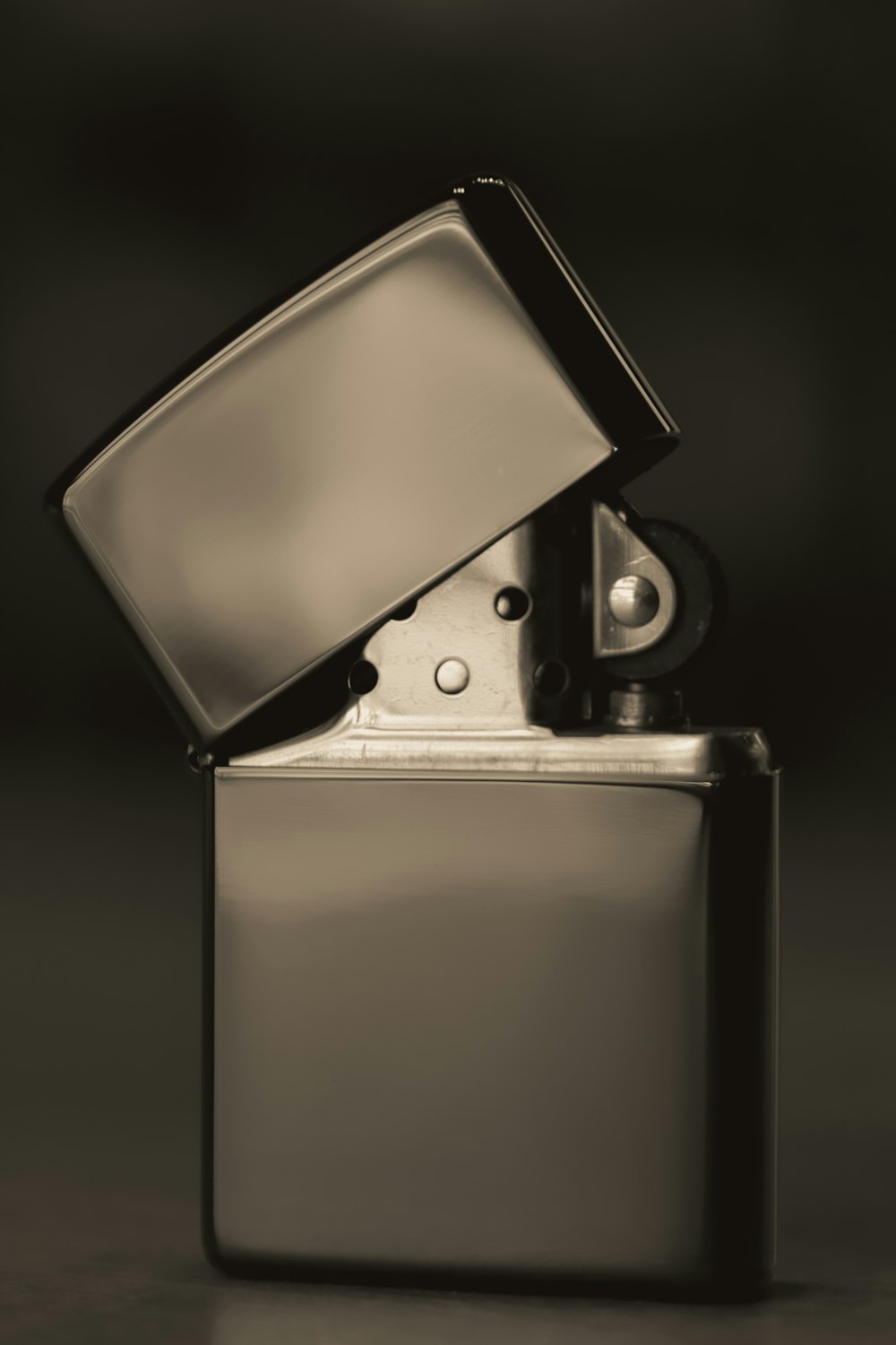 a black and white photo of a lighter