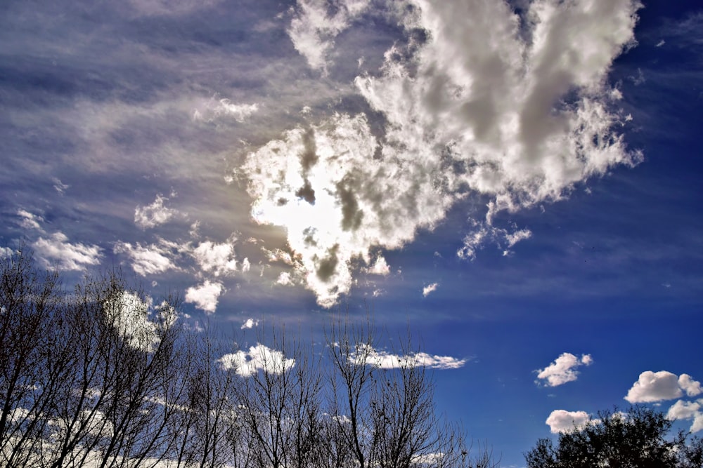 the sun is shining through the clouds in the sky