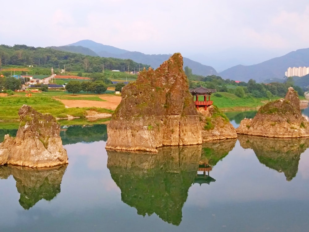 a body of water with some rocks in it