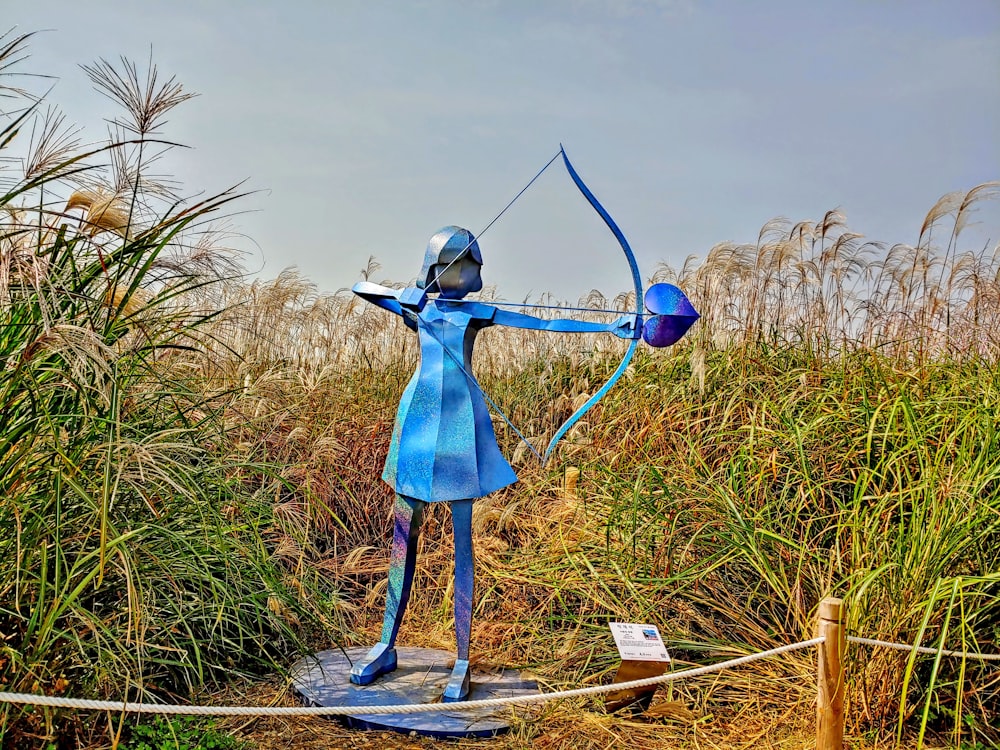a statue of a person with a bow and arrow