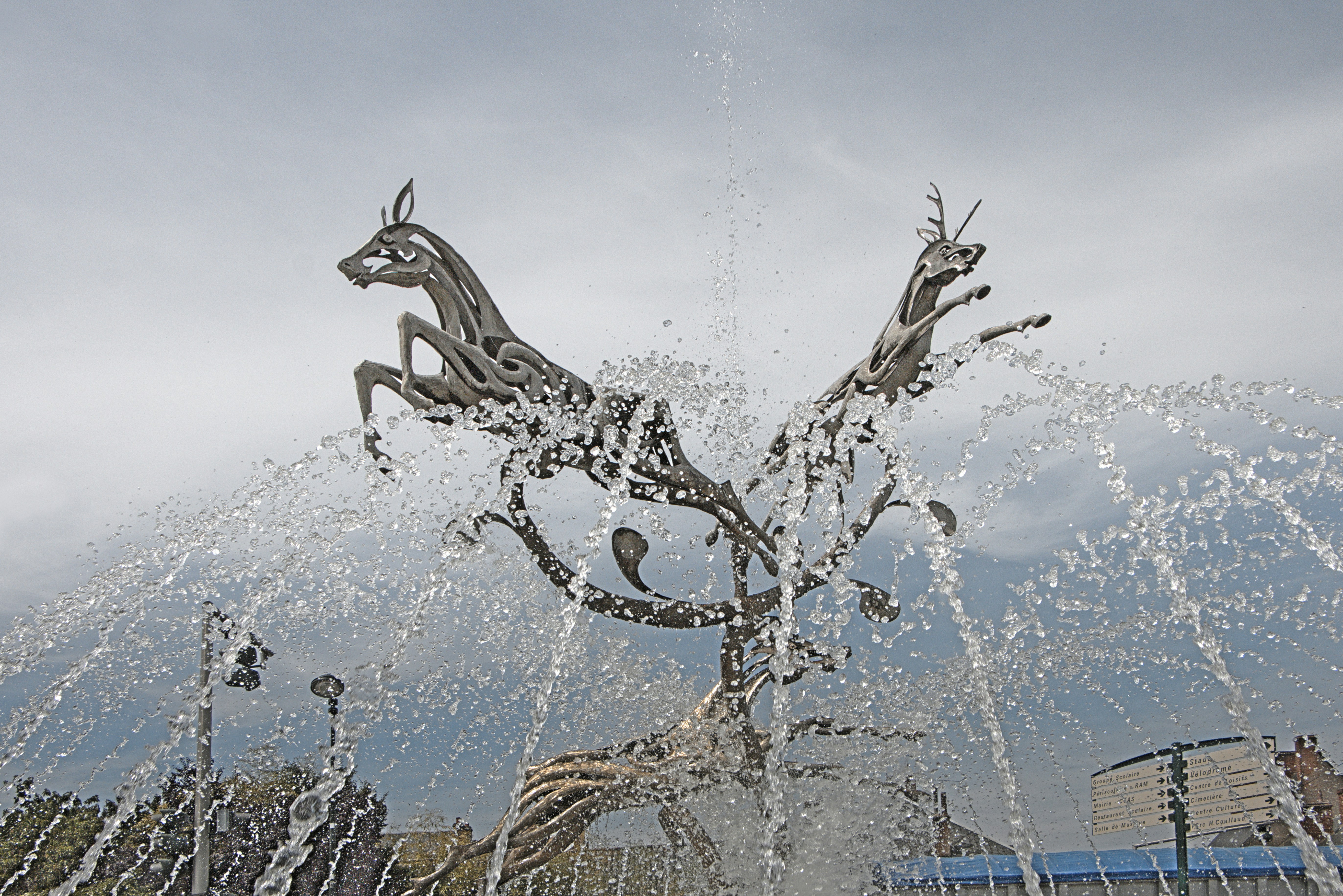 a water fountain with a statue of a horse on top of it
