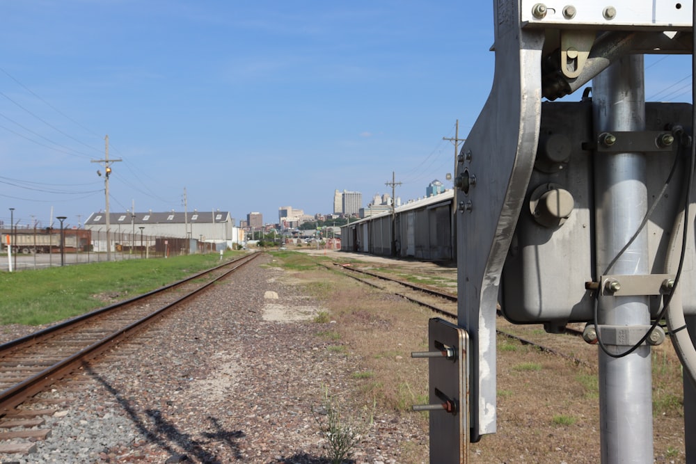 a view of a train track with a sky in the background