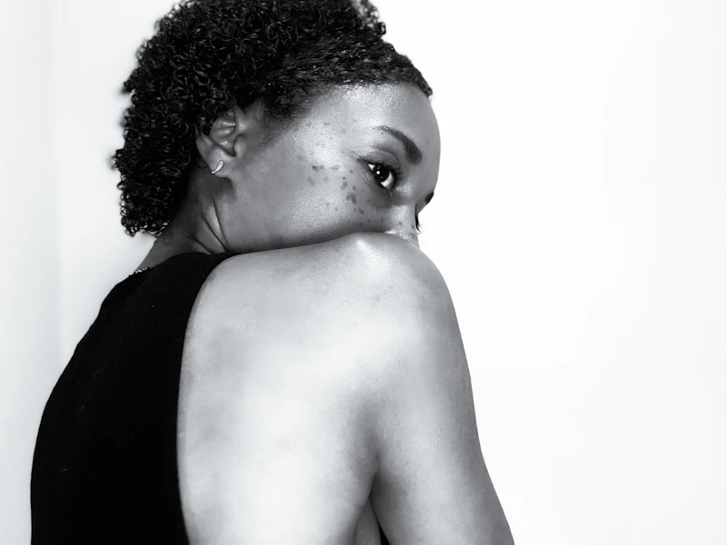 confident curvy woman black and white back view