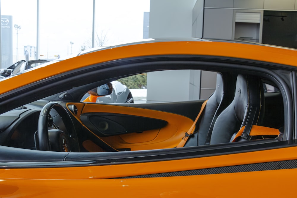 a close up of a sports car with its door open