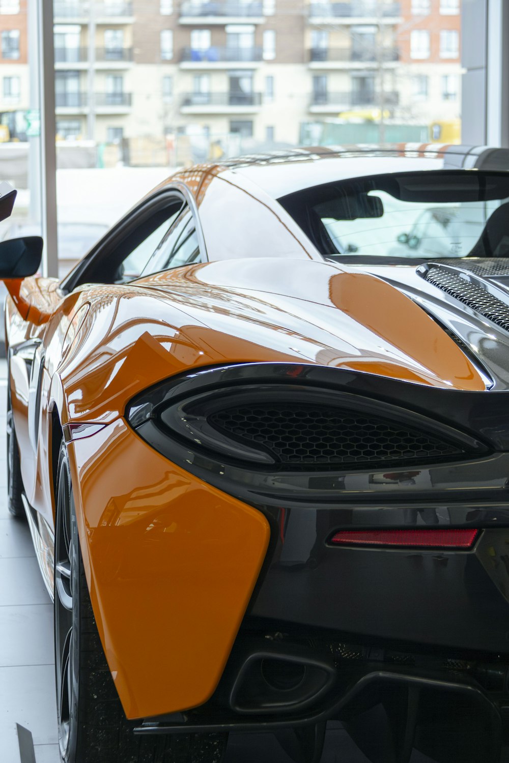 a close up of a sports car in a building