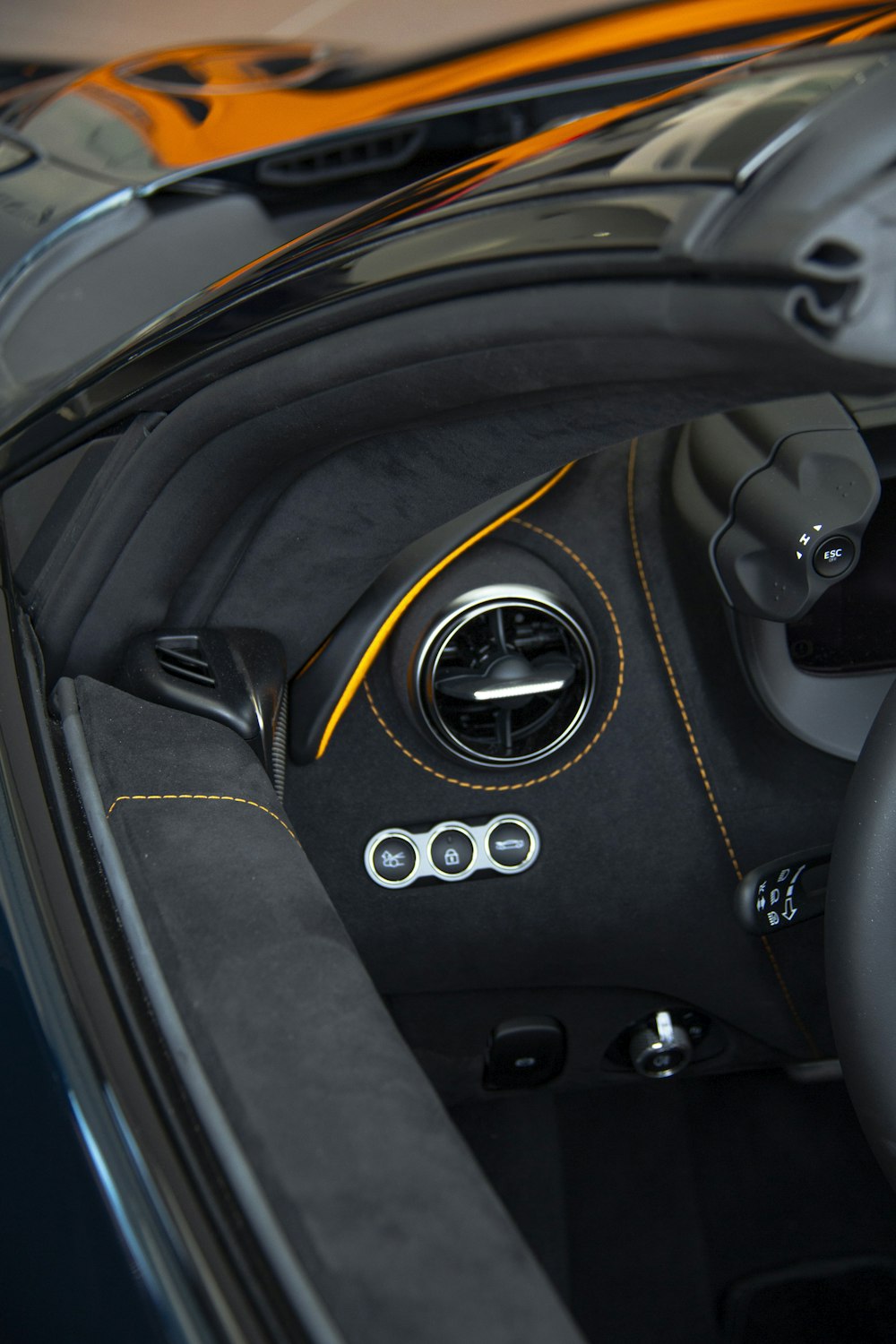 the interior of a sports car with a steering wheel
