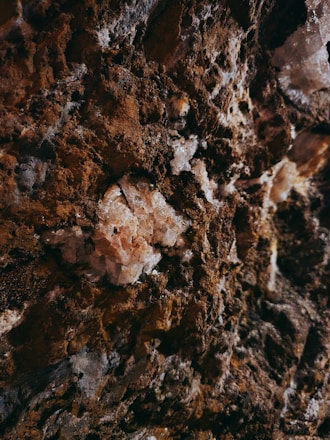 a close up of a rock with dirt on it