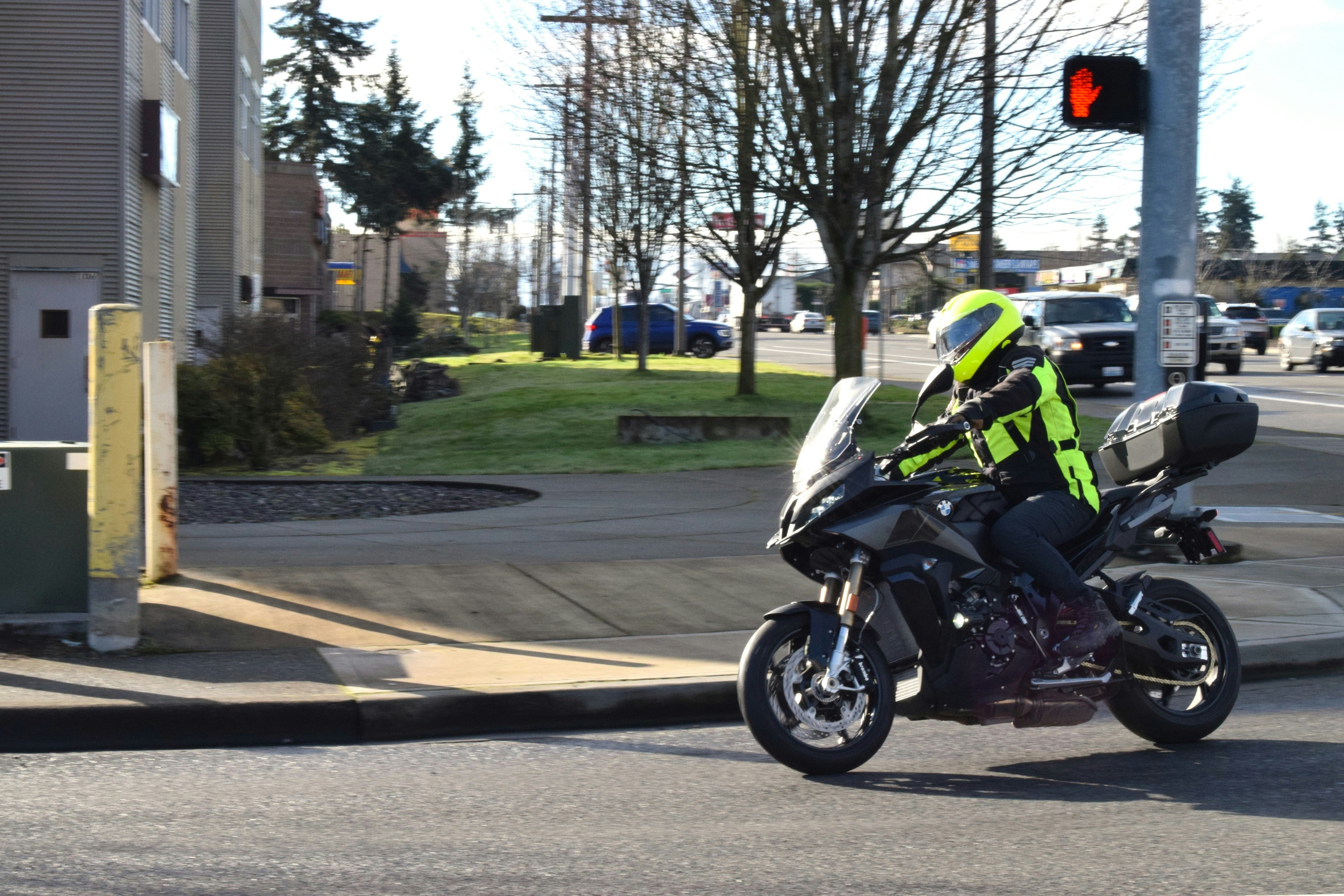 a person riding a motorcycle on a city street