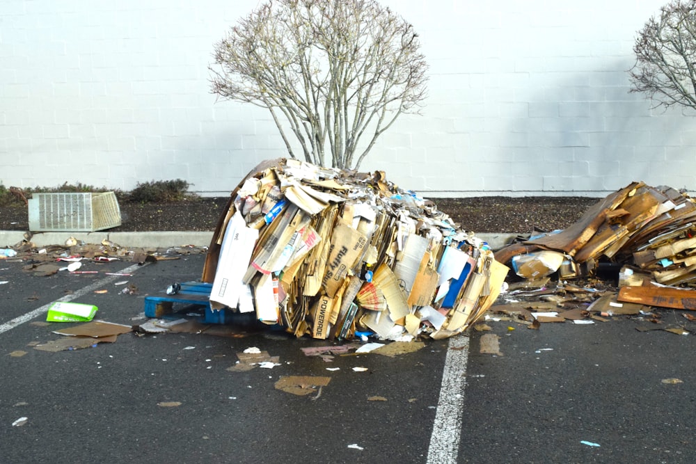 a pile of trash sitting on the side of a road