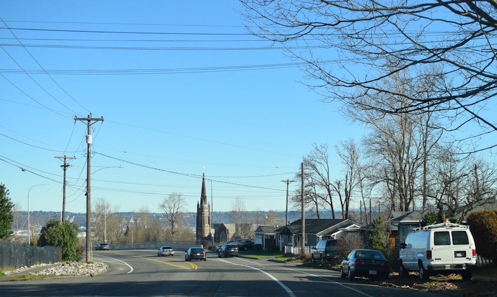 a street with cars parked on the side of it