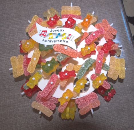a bunch of gummy bears sitting on top of a table