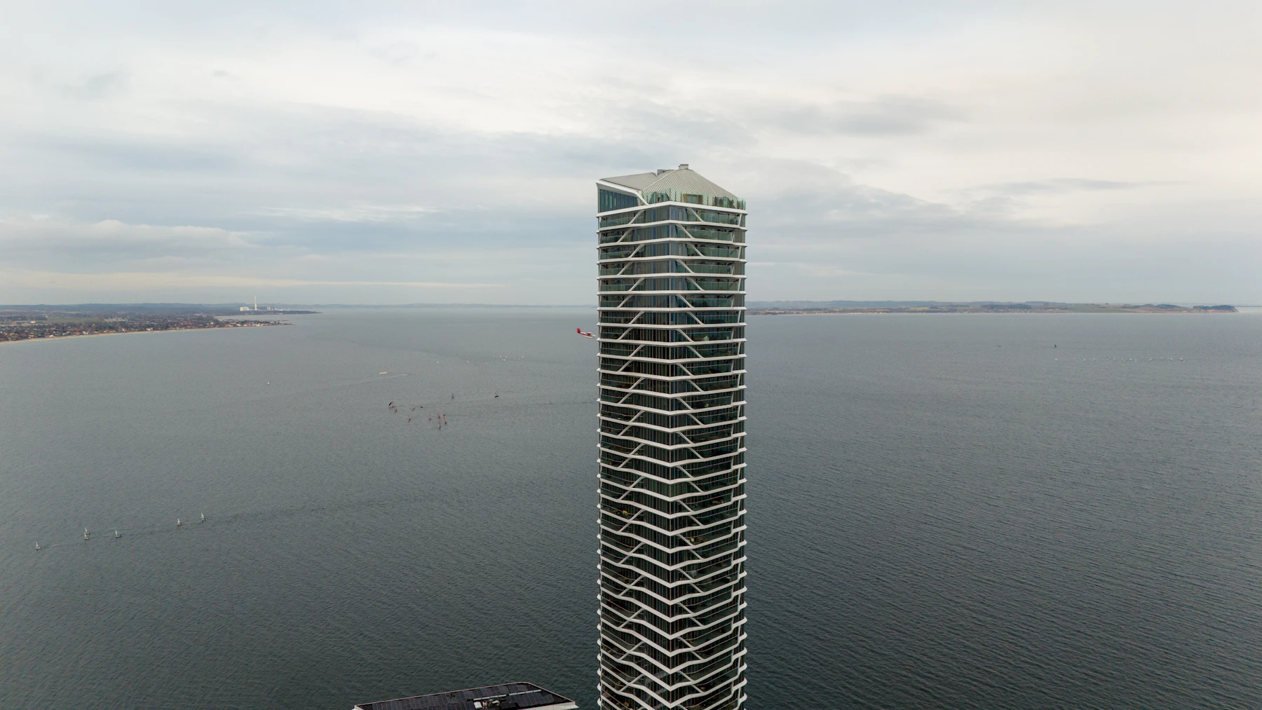 Aerial view of a waterfront residential tower