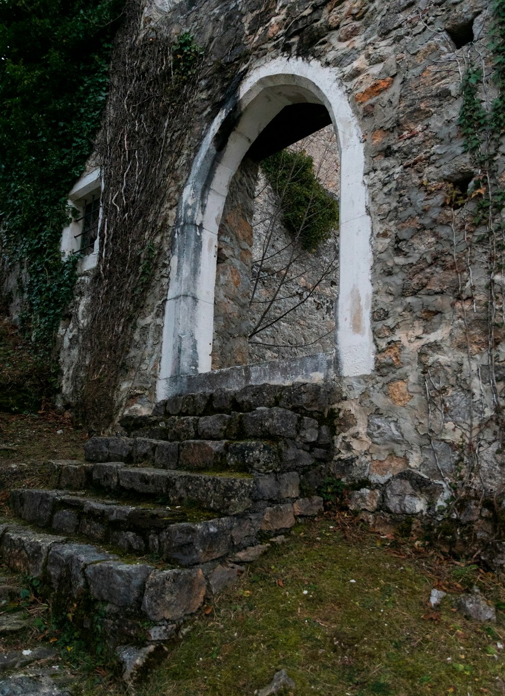 a stone building with a stone staircase leading up to it