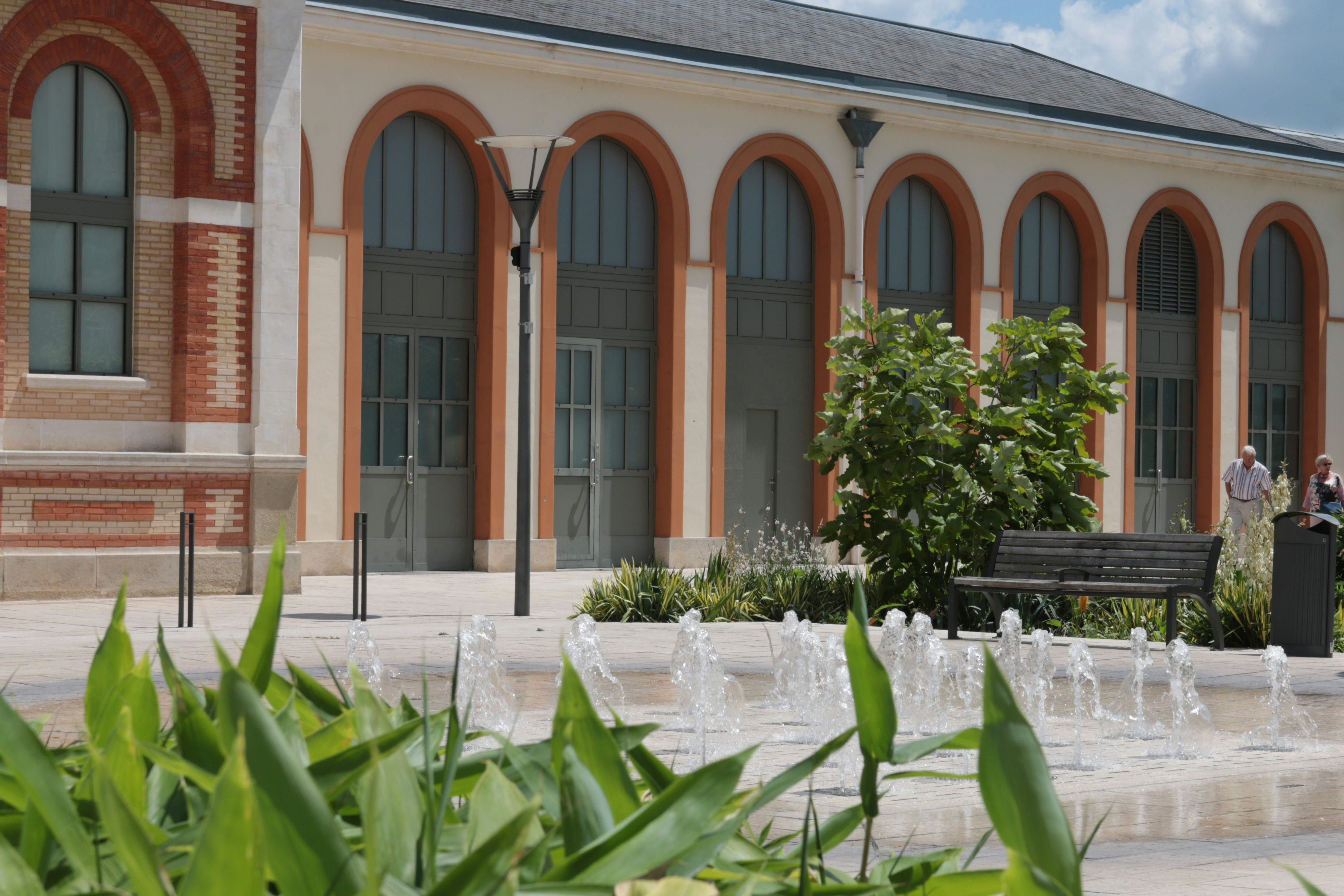 a couple of people that are standing in front of a building