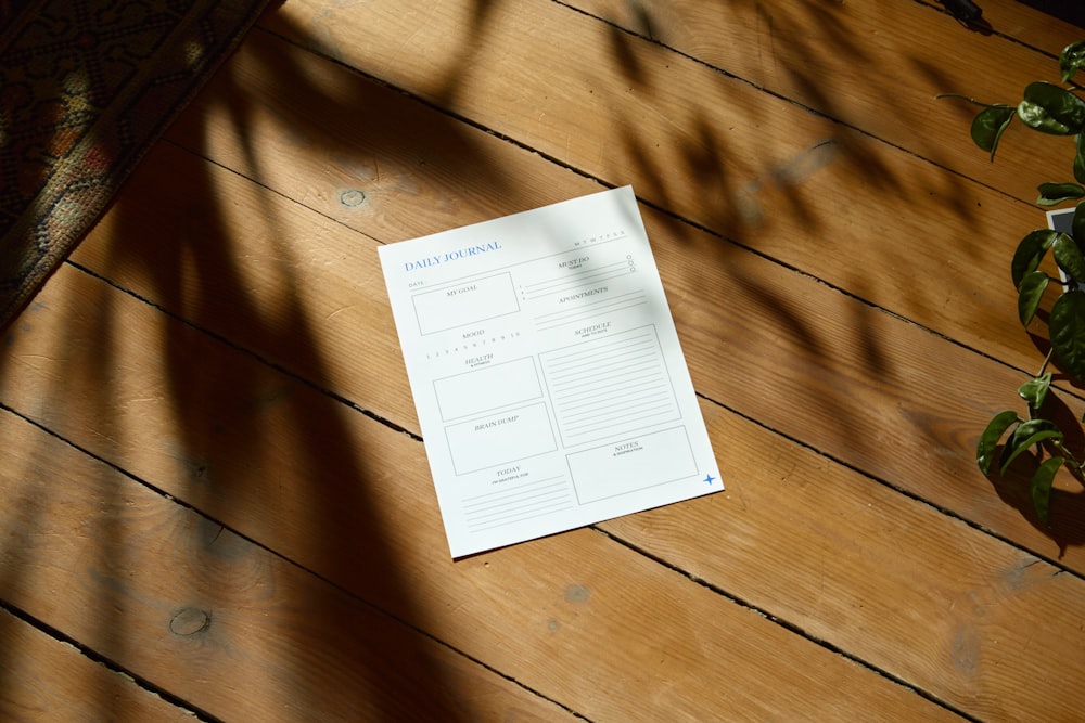 a piece of paper sitting on top of a wooden floor