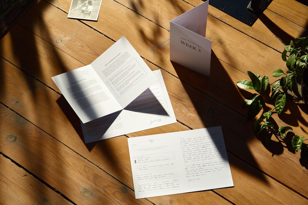 an open book sitting on top of a wooden table