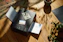 a printer sitting on top of a wooden floor next to a potted plant