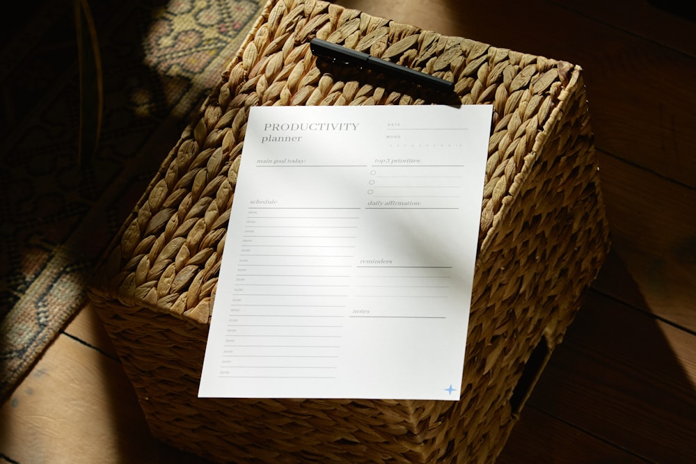 a piece of paper sitting on top of a basket