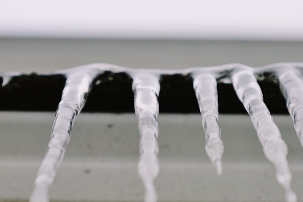 a close up of some ice on a window sill