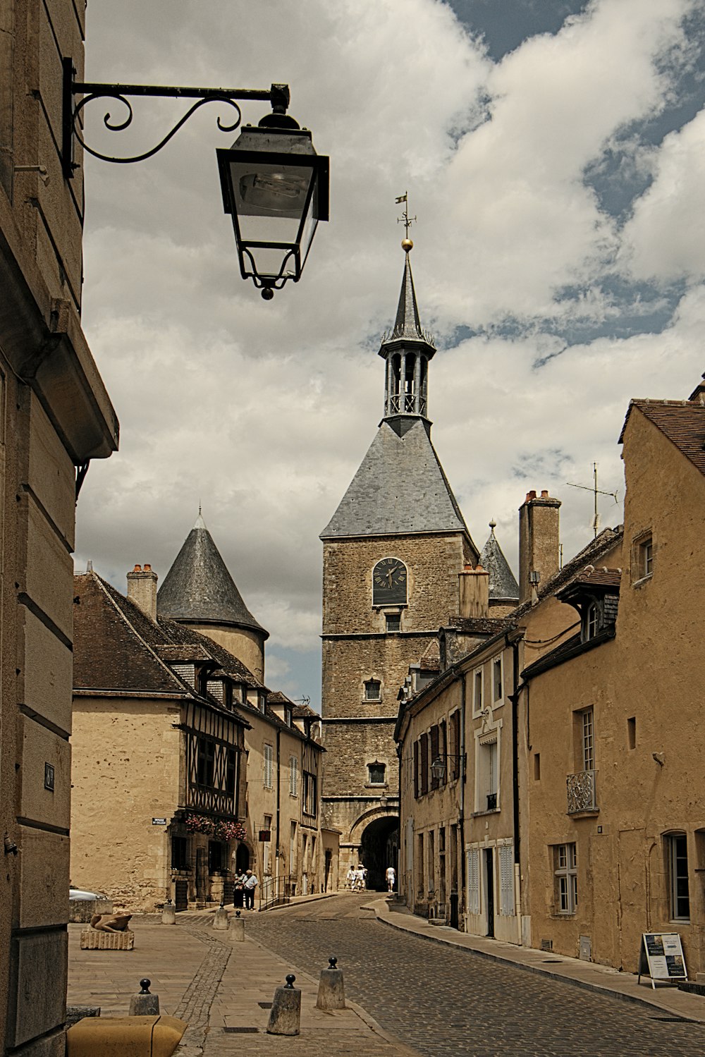 a cobblestone street lined with old buildings