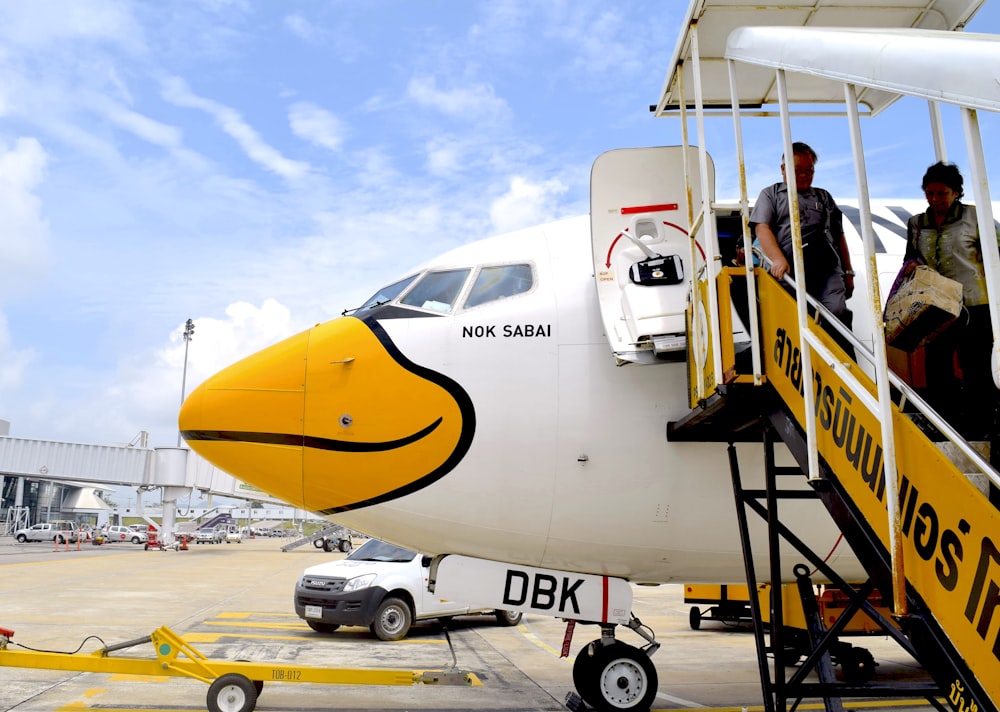 a large jetliner sitting on top of an airport tarmac