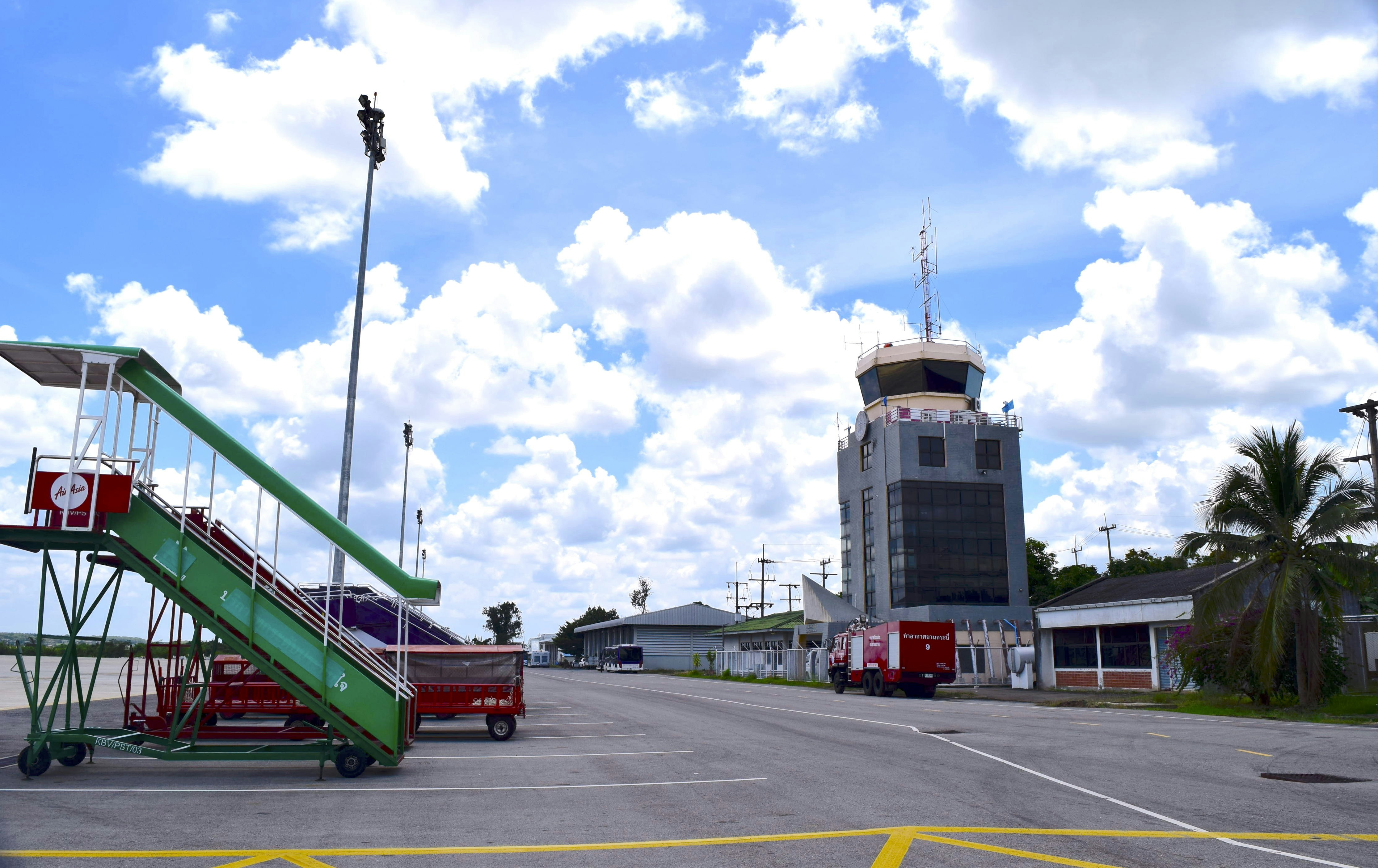 a parking lot with a set of stairs next to a building, 