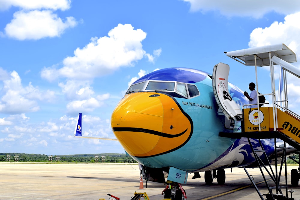 an airplane with a smiley face painted on the side