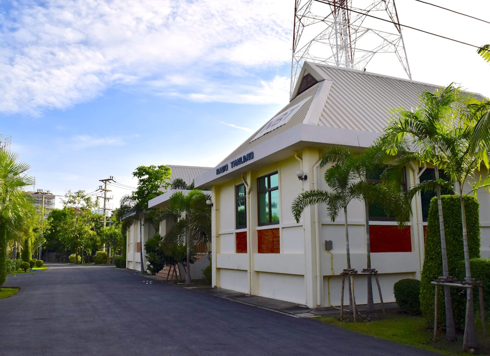 a street lined with houses and palm trees