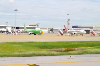 an airport with several planes parked on the tarmac
