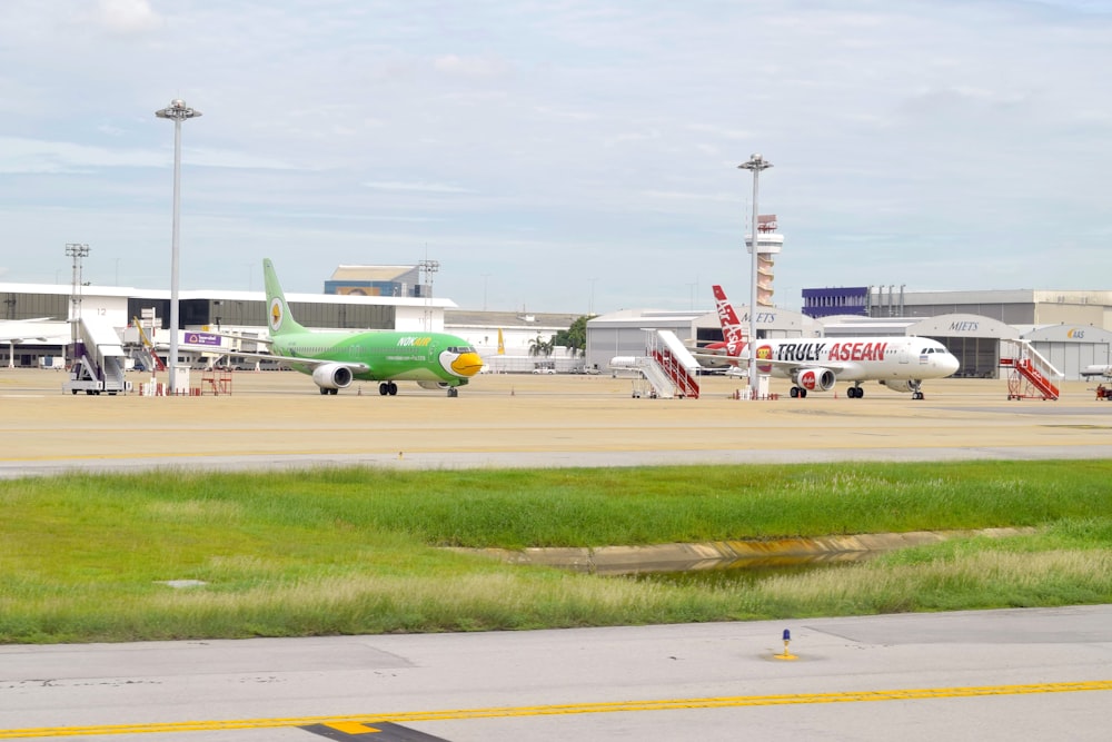 an airport with several planes parked on the tarmac