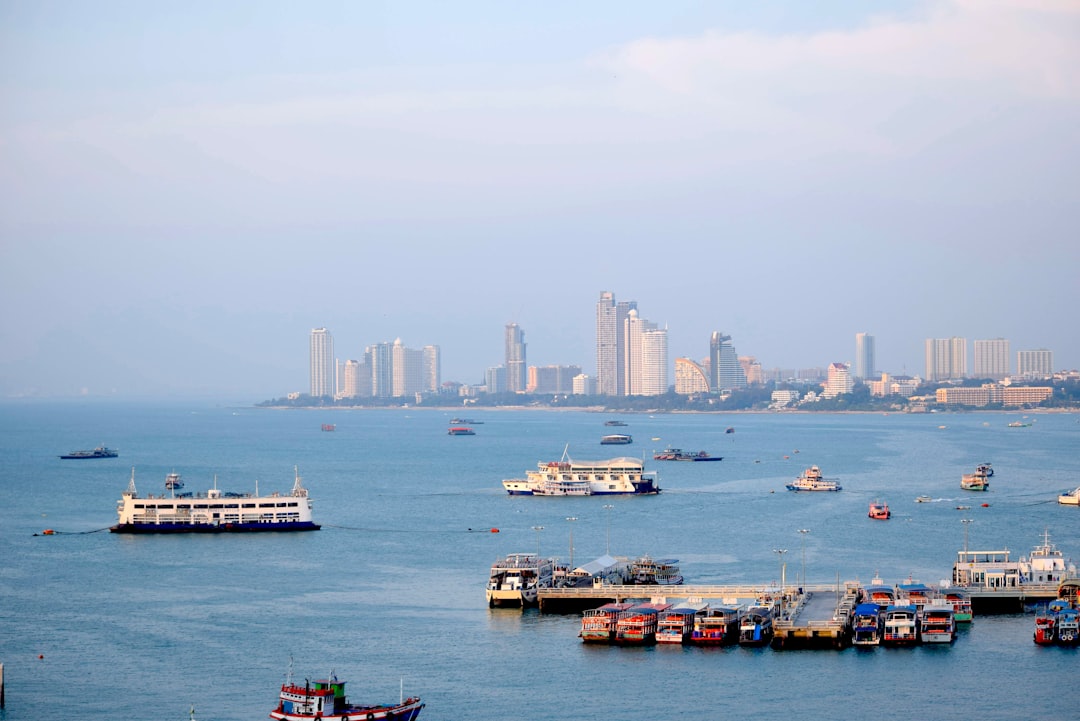 a group of boats floating on top of a large body of water