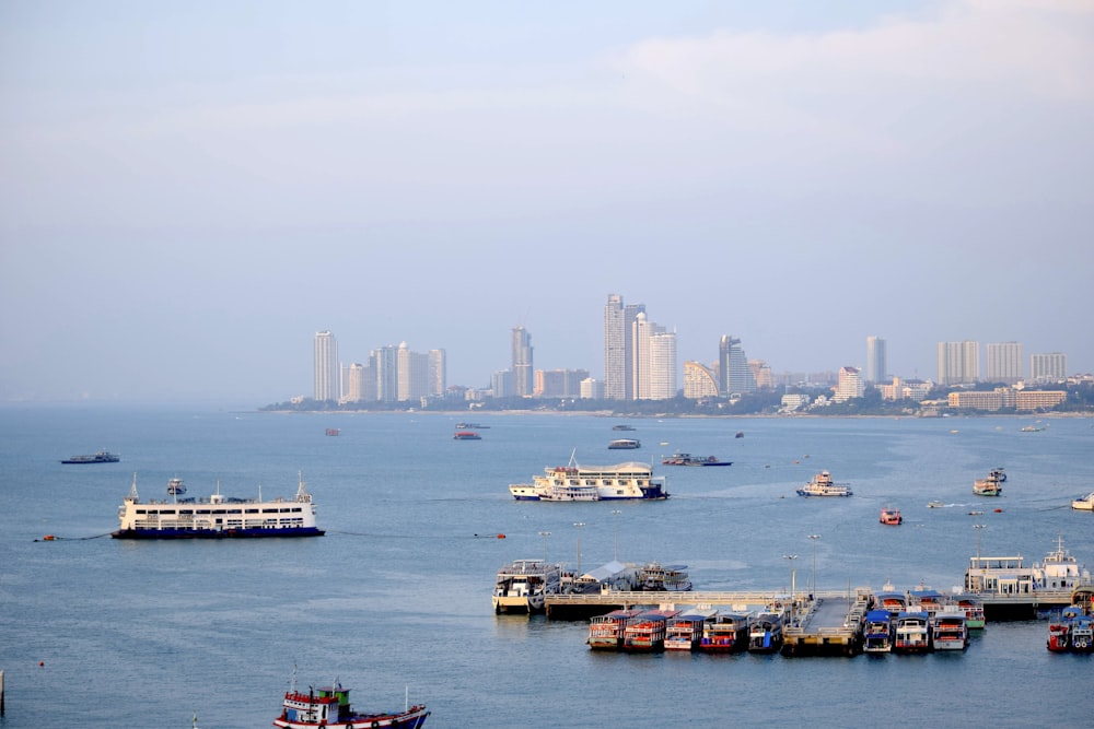 a group of boats floating on top of a large body of water