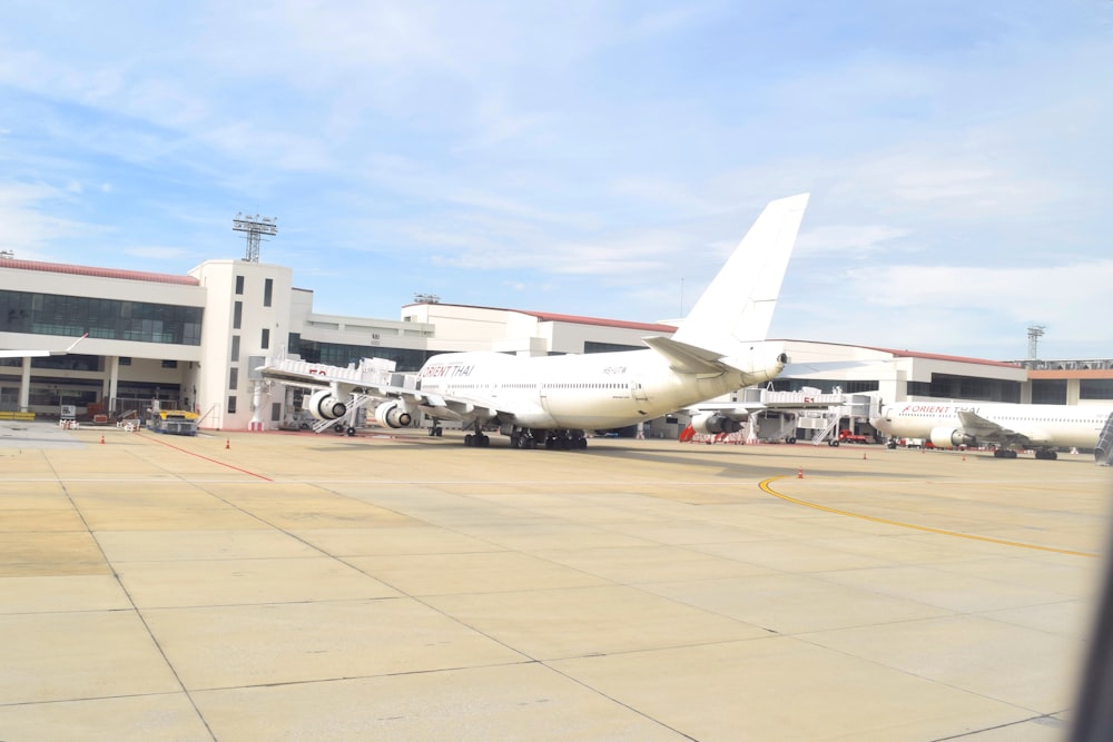 a large jetliner sitting on top of an airport tarmac