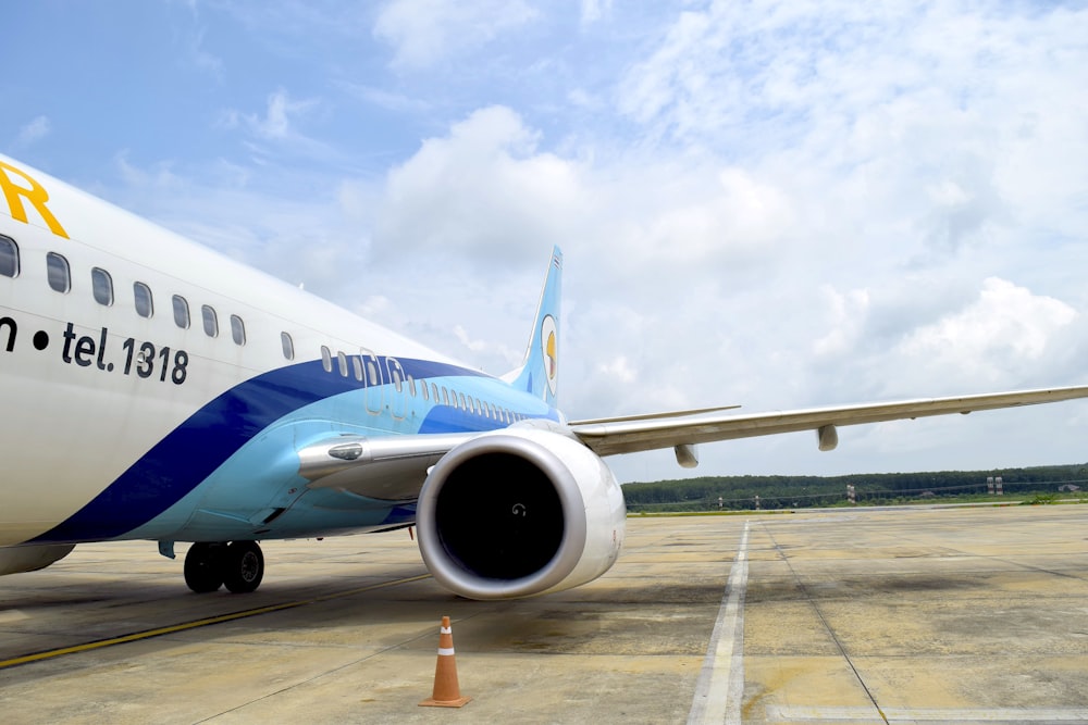 a large jetliner sitting on top of an airport tarmac