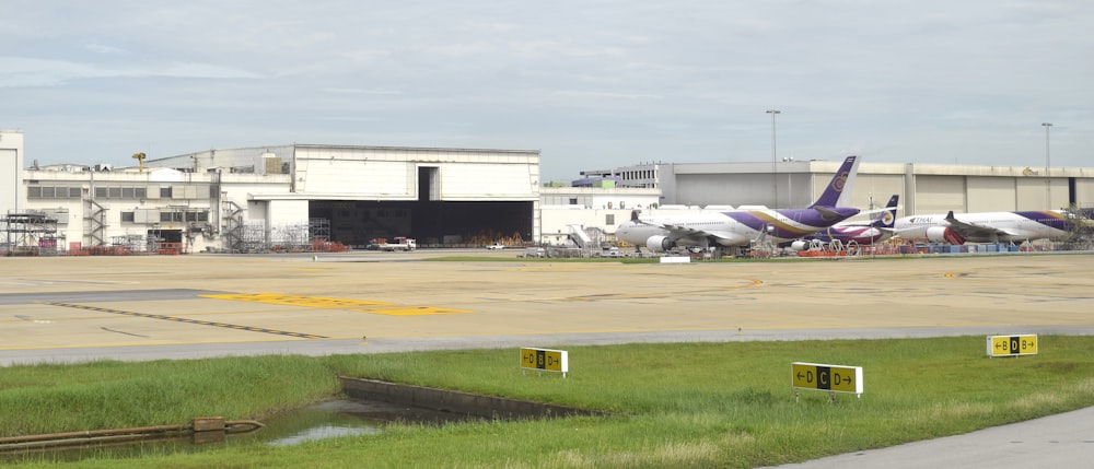 a couple of planes that are on a runway