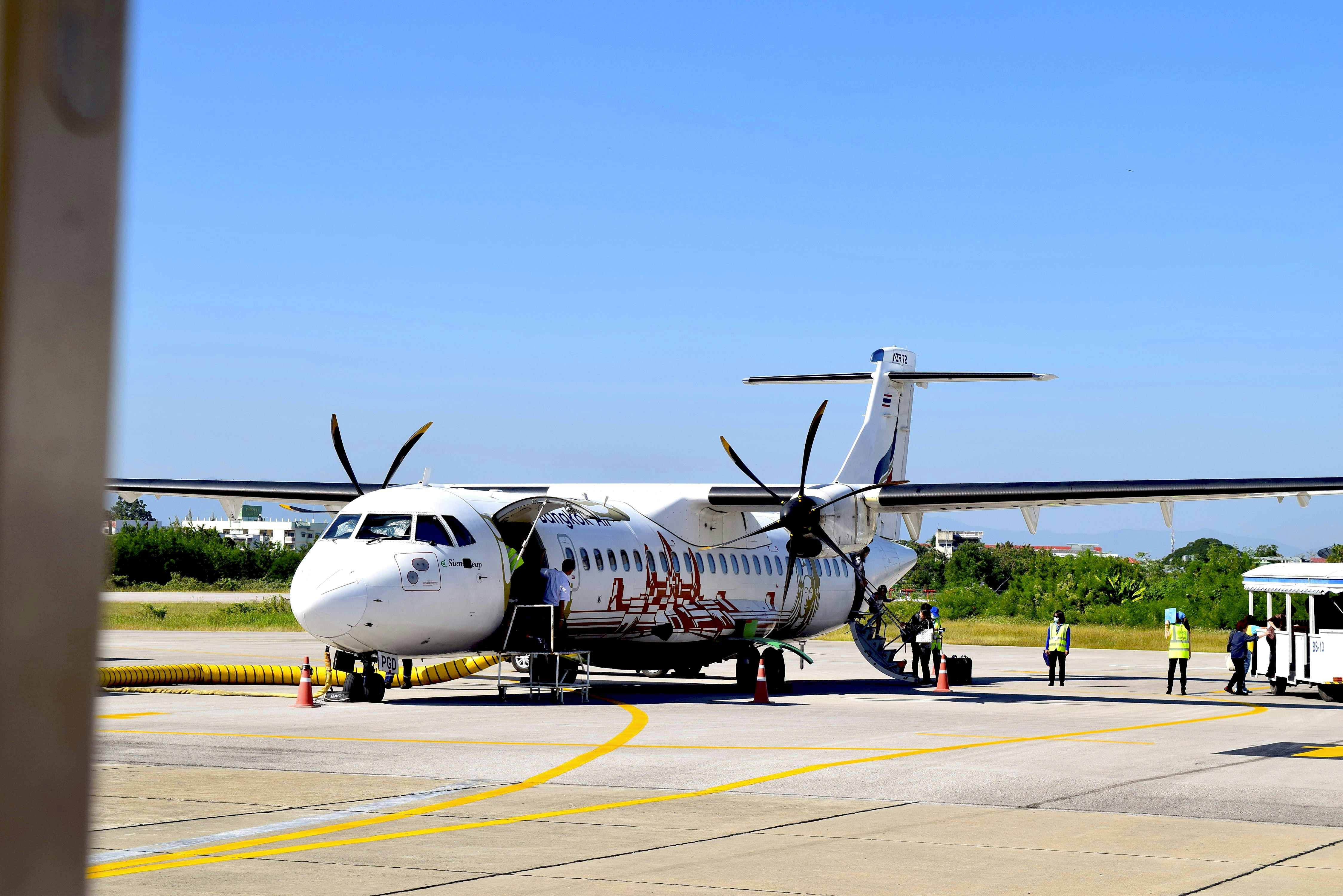 an airplane is parked on the tarmac at an airport, BKP ATR72-500 (HS-PGD) on LPT ramp.