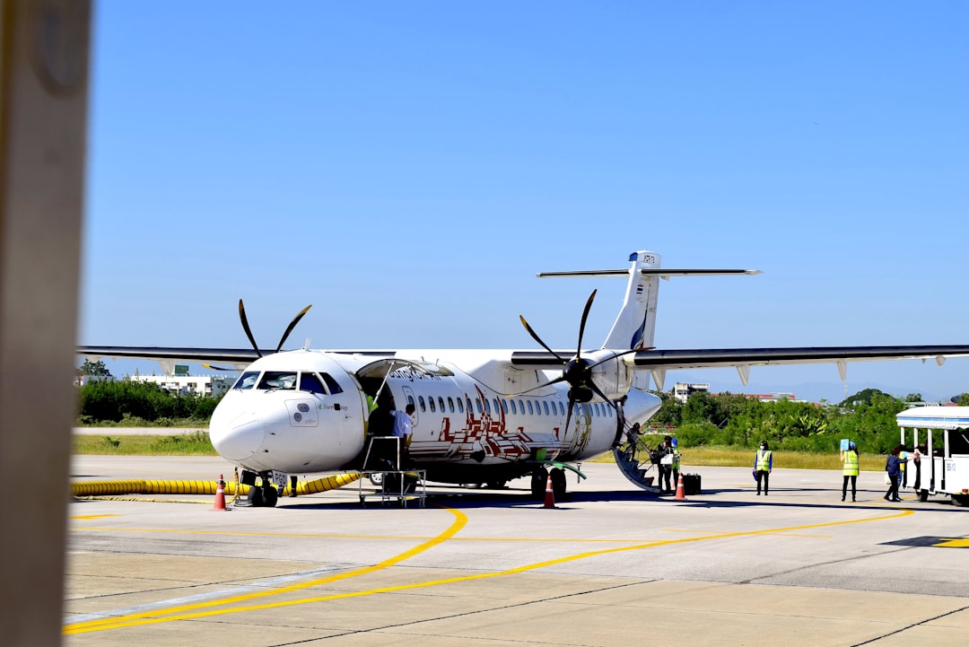 an airplane is parked on the tarmac at an airport, BKP ATR72-500 (HS-PGD) on LPT ramp.