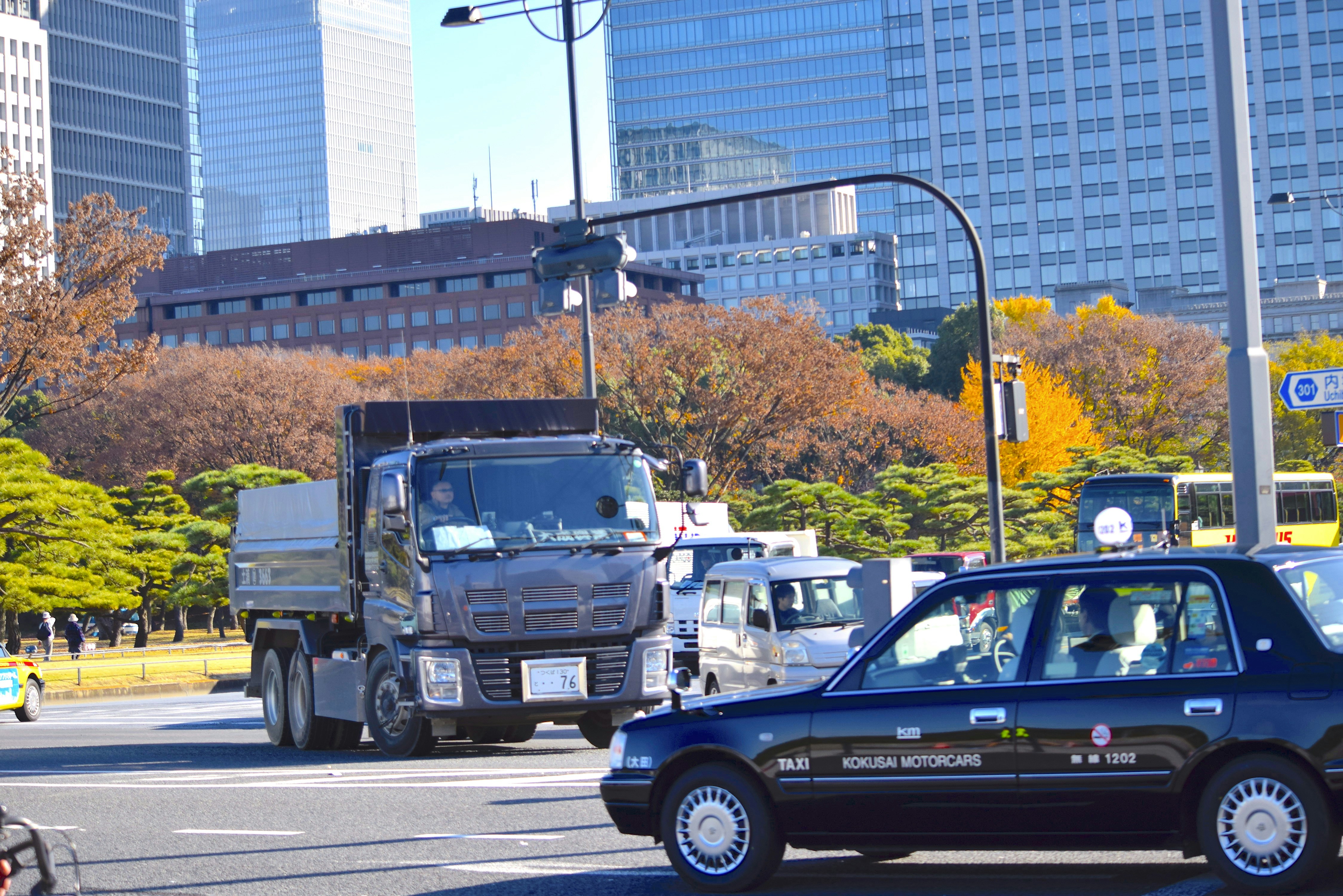 a car and a truck on a city street