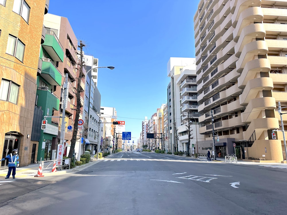 a city street with tall buildings on both sides