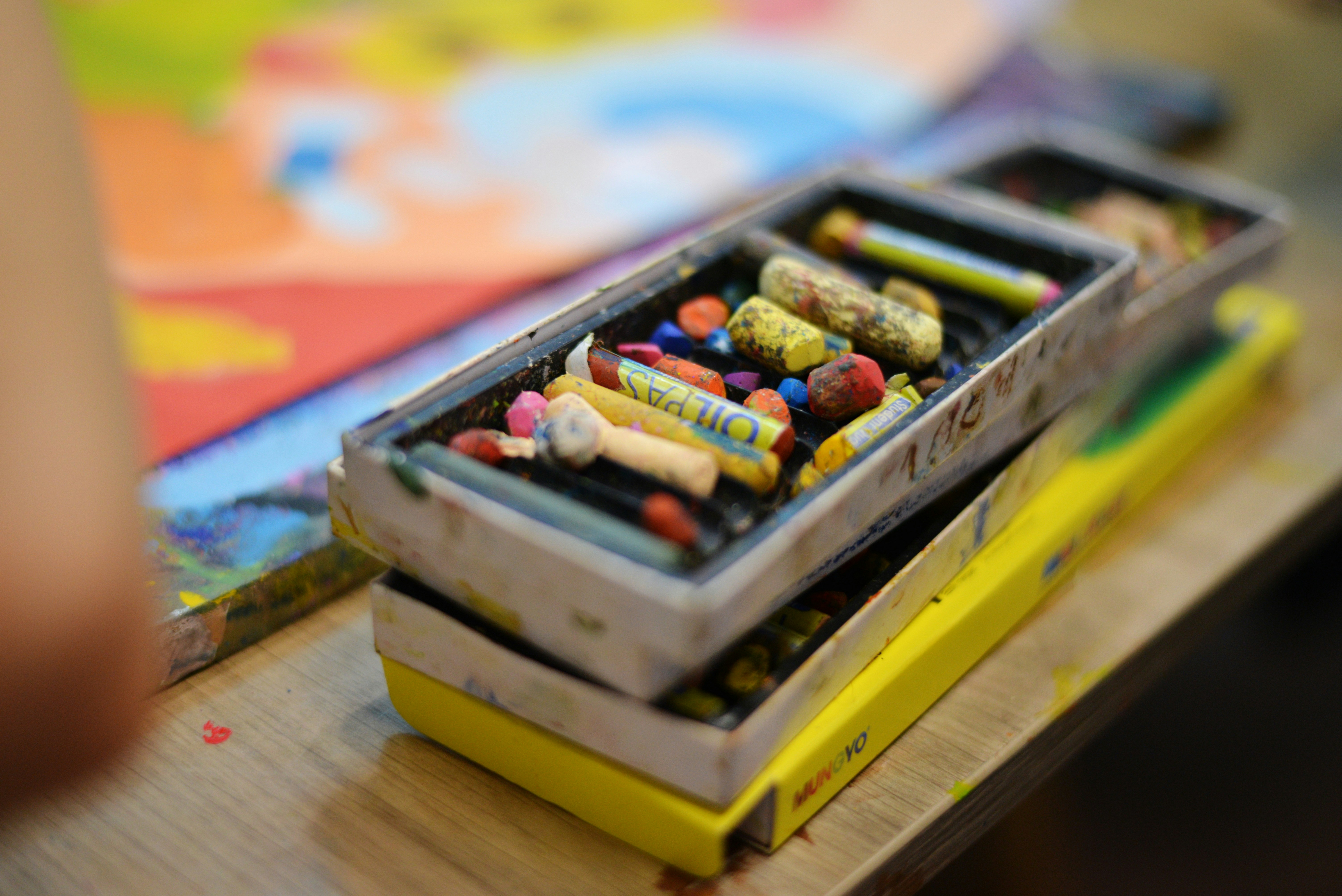 a box of crayons sitting on top of a table
