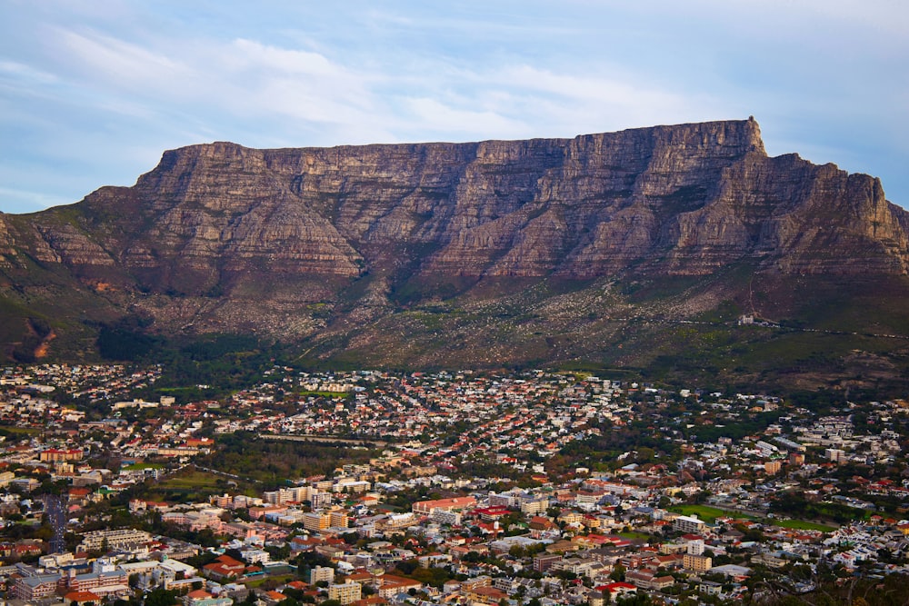 a view of a city with a mountain in the background