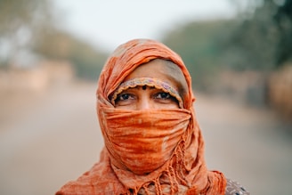 a woman with a scarf around her head