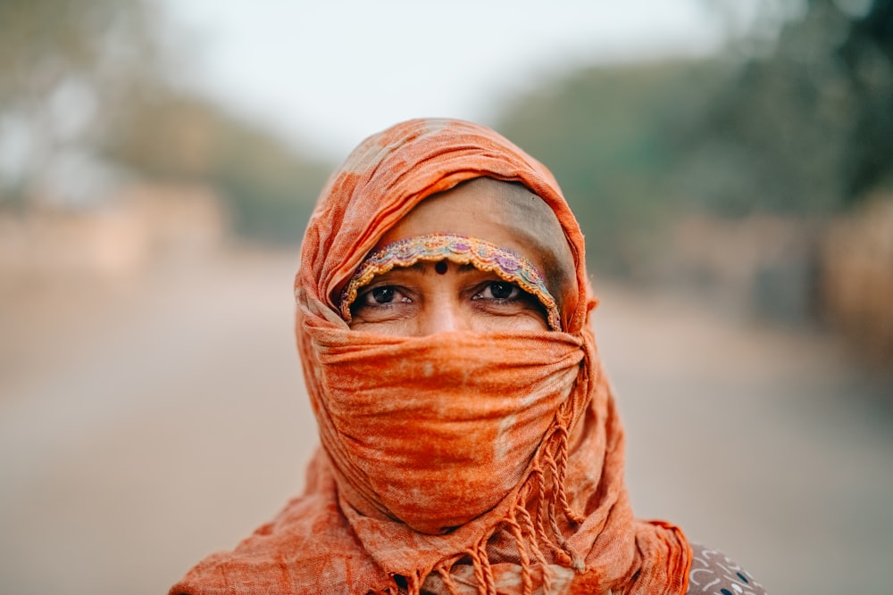 a woman with a scarf around her head