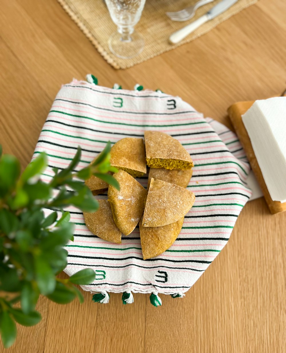 a wooden table topped with a plate of food