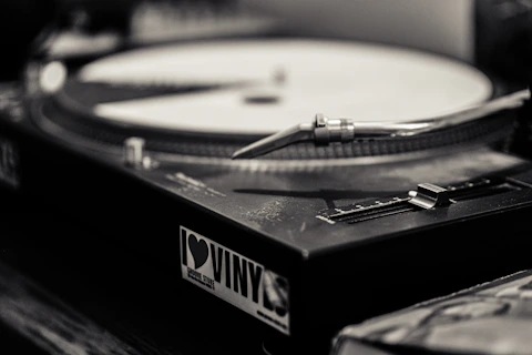a record player sitting on top of a wooden table