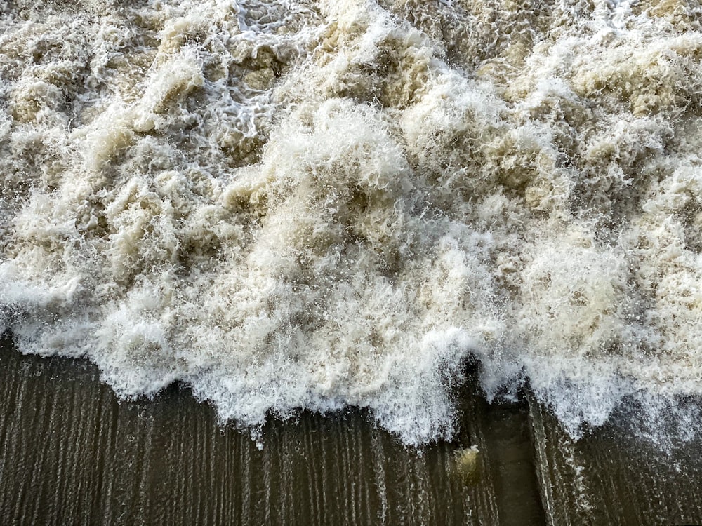 a pile of white foam on top of a wooden floor