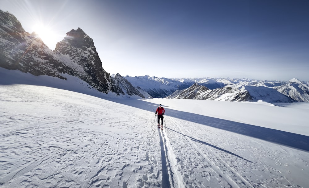 a person cross country skiing in the mountains