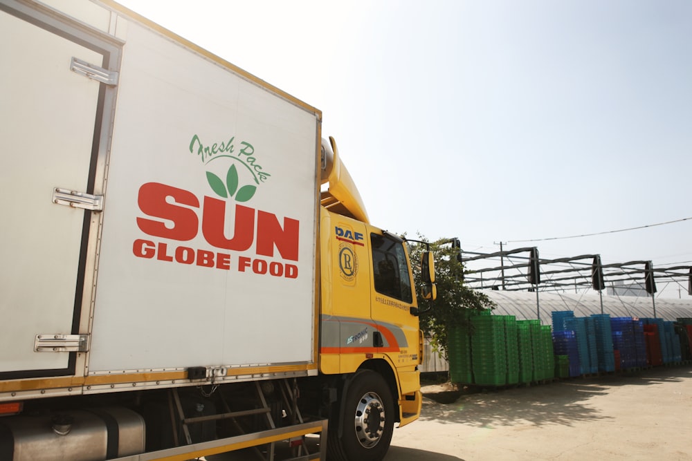 a sun globe food truck parked in a parking lot