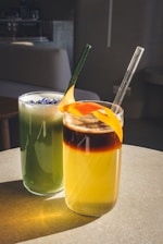 a couple of drinks sitting on top of a table